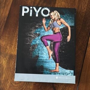 Beachbody PiYo Fitness DVD with Purple and Gray Accents